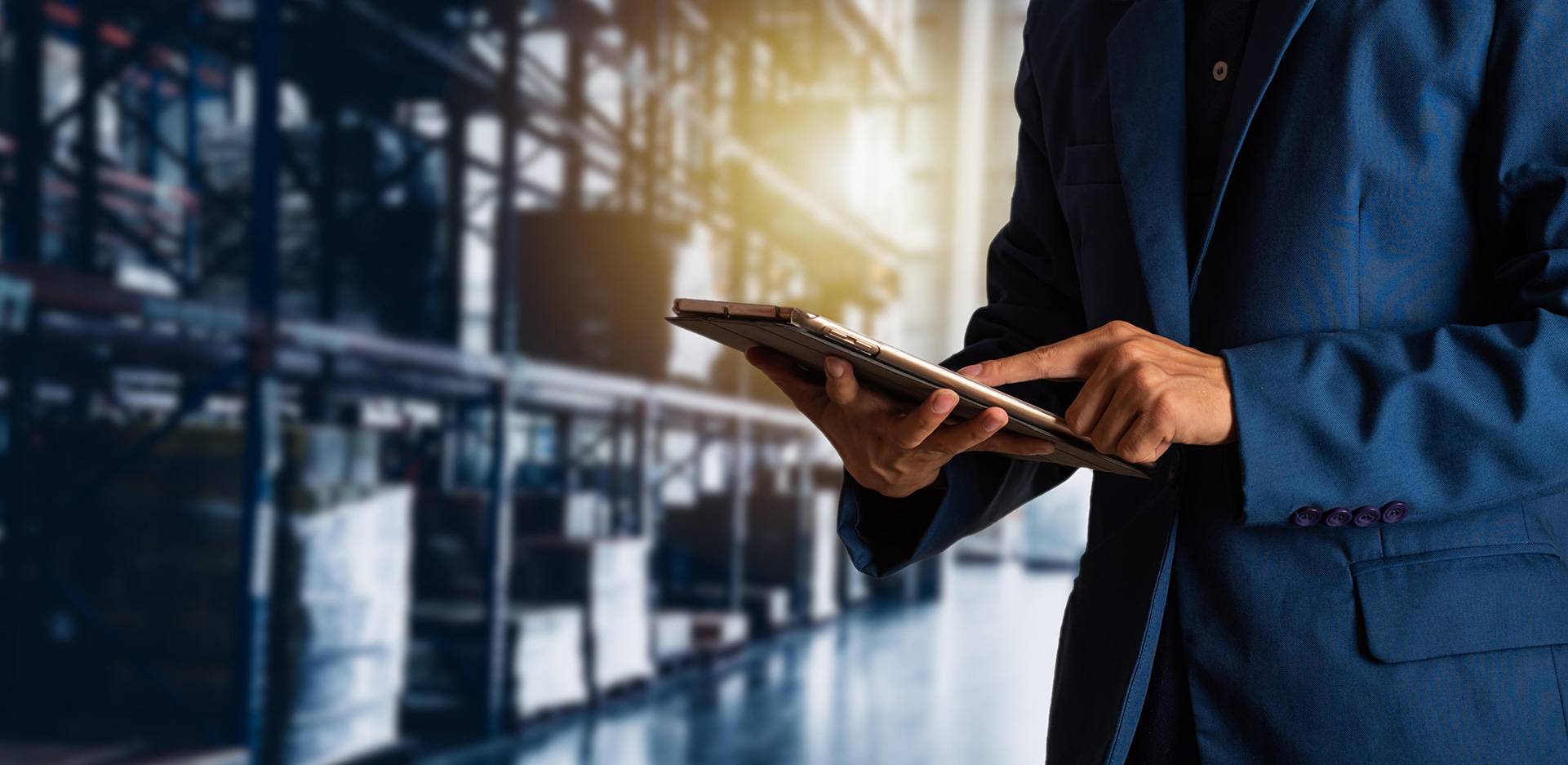 A hand checking something on tablet